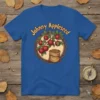 Johnny Appleseed t-shirt design featuring apples on a branch and a bag of seeds within a circular frame