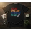 Joker Smoker Midnight Toker text design on a black t-shirt with colorful distressed lettering and smoke graphic