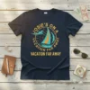Navy t-shirt with "Josie's On A Vacation Far Away" text, sailboat, and airplane graphic