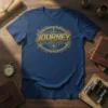 Blue t-shirt with gold "JOURNEY" text, anchor, compass, and nautical border design