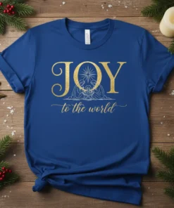 Royal blue t-shirt with gold text "JOY to the world" and a simple nativity scene graphic, featuring Mary, Joseph, and
