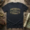 Junction City Kansas Est 1854 vintage design on navy blue t-shirt, featuring distressed golden text and train graphics