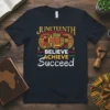 Juneteenth Believe Achieve Succeed text design with African Kente patterns and symbols on a black t-shirt