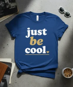 Blue t-shirt with white and gold text that reads "just be cool." featuring a small heart and line accent