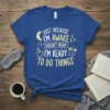 Just Because I'm Awake Doesn't Mean I'm Ready to Do Things quote t-shirt with moon, coffee cup, and alarm clock