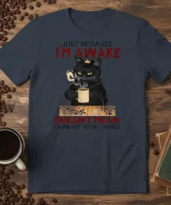 Black cat wearing a crown drinking coffee with text "Just Because I'm Awake Doesn't Mean I'm Ready To Do Things"