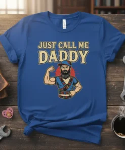 Just Call Me Daddy text with a muscular cartoon dad flexing his bicep on a royal blue t-shirt