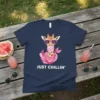 Just Chillin' text on a navy blue t-shirt with a cartoon giraffe wearing pink sunglasses and blowing bubblegum