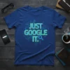 Blue t-shirt with "JUST GOOGLE IT." in neon green and blue text, featuring circuit board graphics and a magnifying glass
