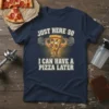 Funny t-shirt with text "Just Here So I Can Have A Pizza Later" featuring a cartoon slice of pizza lifting