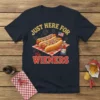 T-shirt design with text "JUST HERE FOR the WIENERS" and graphics of hot dogs, ketchup, and an American flag