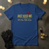 Just Kiss Me We Can Talk Later text with red lips graphic on a royal blue t-shirt