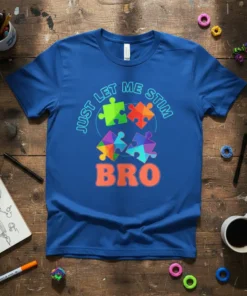 Blue t-shirt with colorful puzzle pieces and the text "Just Let Me Stim Bro" in bold orange font