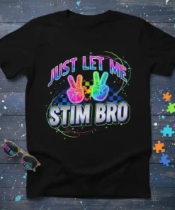 Black t-shirt with "JUST LET ME STIM BRO" text, colorful peace signs, and puzzle piece graphics