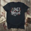 Just Married 2025 text with wedding rings and hearts graphic on a black t-shirt