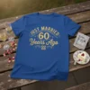 Blue t-shirt with gold glitter text "JUST MARRIED 60 Years Ago" for a 60th wedding anniversary celebration