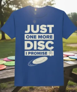 JUST ONE MORE DISC I PROMISE text with a disc graphic on a blue t-shirt, disc golf theme