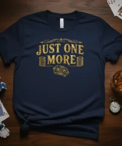 Navy t-shirt with gold text "JUST ONE MORE" featuring stacks of coins and dice, perfect for gambling enthusiasts