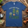 Blue t-shirt with "JUST ONE MORE PLANT" text and illustrations of a terrarium, potted plant, and hanging plant