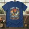 Just A Boy Who Loves Chickens text with vintage rooster, hens, and chicks graphic on a blue t-shirt