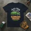 Just A Boy Who Loves Garbage Trucks T-Shirt featuring a green garbage truck graphic and bold text