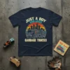 Just A Boy Who Loves Garbage Trucks t-shirt with a vintage sunset graphic of a garbage truck and city skyline