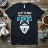 Just A Boy Who Loves Huskies text with geometric husky face graphic on a navy blue t-shirt