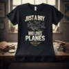 Just A Boy Who Loves Planes t-shirt with airplane graphic, gold and teal text, aviation theme