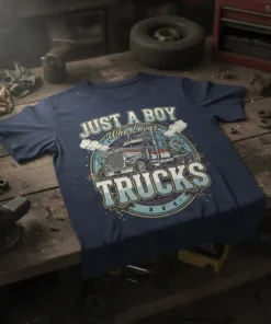 Just A Boy Who Loves Trucks graphic tee with a vintage semi-truck illustration and bold typography