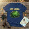Just A Bush... text with a camouflage-framed green bush graphic on a navy t-shirt