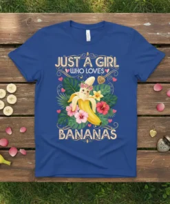 Just A Girl Who Loves Bananas text with a cute smiling banana graphic and tropical flowers on a blue t-shirt