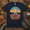 Just A Girl Who Loves Bigfoot retro sunset t-shirt design with Sasquatch graphic