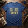Gold text "JUST A GIRL WHO LOVES BOB" inside a heart shape with stars and a small girl figure on