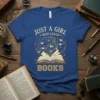 Just A Girl Who Loves Books quote on a blue t-shirt with an open book and flying paper cranes graphic