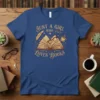Just a girl who loves books quote t-shirt with an open book, feather, glasses, and coffee cup graphic