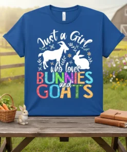 T-shirt with white text "Just a Girl who loves" above colorful block letters spelling "BUNNIES" and "GOATS", featuring silhouette graphics