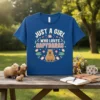 Just A Girl Who Loves Capybaras text with a cute capybara illustration on a blue t-shirt