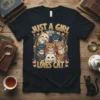 Just A Girl Who Loves Cat text with a group of colorful cats illustration on a black t-shirt