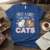 Just A Girl Who Loves Cats text with three cute cats illustration on a blue t-shirt design