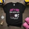 Black t-shirt with neon pink text "JUST A GIRL WHO LOVES CATS" and white text "Volleyball" with a cat, volleyball
