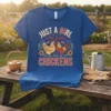Just A Girl Who Loves Chickens text design with chicken graphics on a blue t-shirt