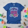 Blue t-shirt with "JUST A GIRL WHO LOVES DOGS & SLIME" text and glitter accents, featuring paw prints and colorful