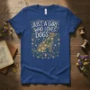 Just A Girl Who Loves Dogs quote with a floral dog silhouette on a navy blue t-shirt