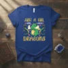 Just A Girl Who Loves Dragons text with cute green dragon and blue dragons graphic on a blue t-shirt