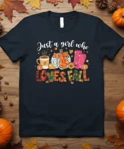 Just a girl who LOVES FALL text with pumpkin, coffee mug, and boots graphic on a navy t-shirt