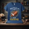 Just A Girl WHO WHO loves FOOTBALL text design with a football graphic on a blue t-shirt
