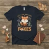 Just A Girl Who Loves Foxes text with a cute cartoon fox and hearts graphic on a navy t-shirt