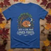 Just A Girl Who Loves Foxes text on a blue t-shirt with a sleeping fox under a tree graphic