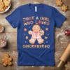 Just a girl who loves gingerbread quote with a cute gingerbread man holding a mug, on a blue t-shirt