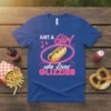 Just A Girl who Loves Glizzies text with a hot dog graphic on a royal blue t-shirt, perfect for food